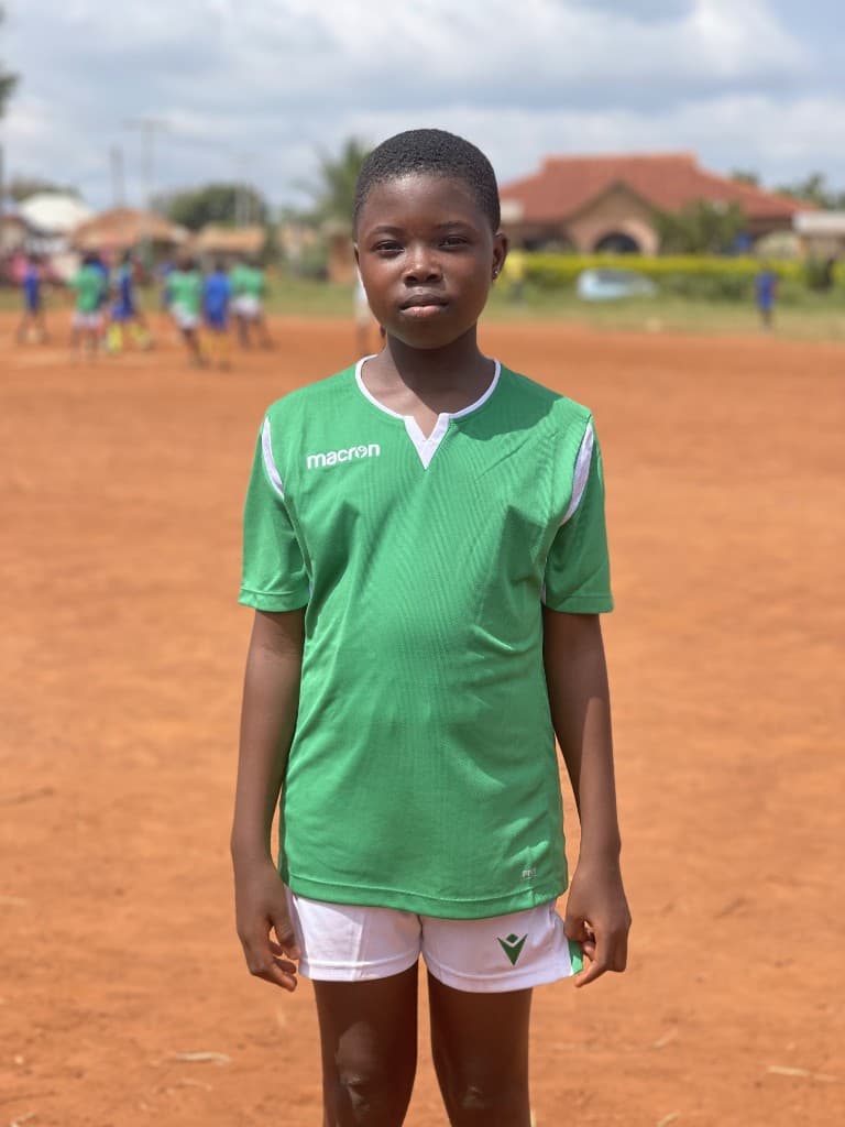 Angelina Mensah in her Girls4Goals football kit on the community pitch